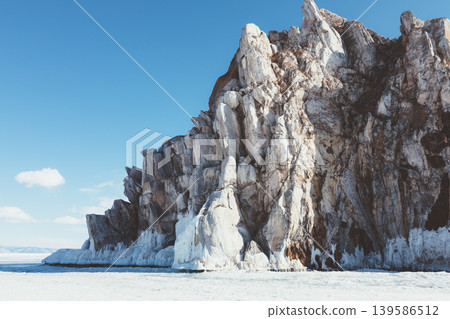 Shaman Rock Shamanka on frozen Lake Baikal in winter, Olkhon Island Shaman Rock Shamanka on frozen Lake Baikal in winter, Olkhon Island 139586512
