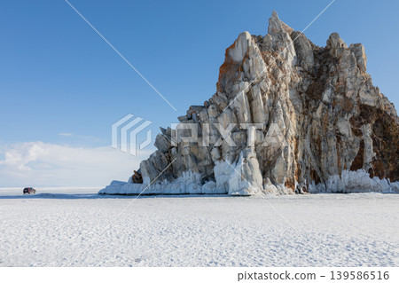 Shamanka Rock on frozen Lake Baikal near Khuzhir village, winter landscape Shamanka Rock on frozen Lake Baikal near Khuzhir village, winter landscape 139586516