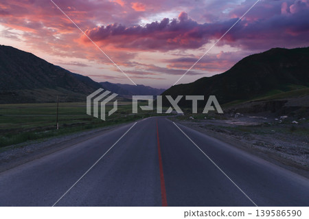 Scenic Chuysky Trakt highway through Altai Mountains valley at dramatic sunset Scenic Chuysky Trakt highway through Altai Mountains valley at dramatic sunset 139586590
