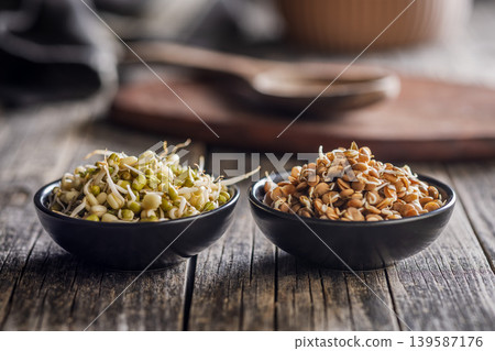 Fresh Sprouts in Bowls With Lentil and Mung Beans on Rustic Wooden Table, Healthy Vegan Food Fresh Sprouts in Bowls With Lentil and Mung Beans on Rustic Wooden Table, Healthy Vegan Food 139587176