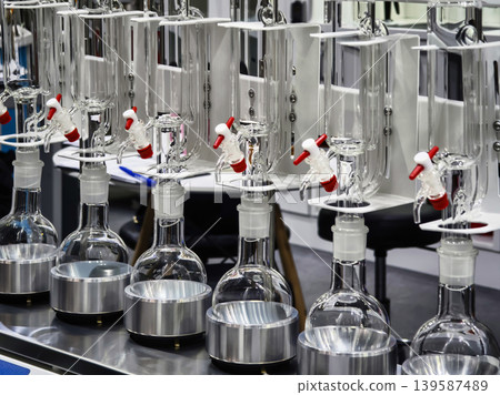Laboratory setup for experiments with glassware and equipment during the day in a research facility 139587489