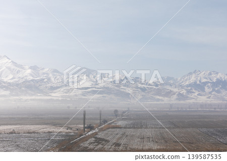 Winter panorama from Burana Tower with snowy Tian Shan mountains, Kyrgyzstan 139587535