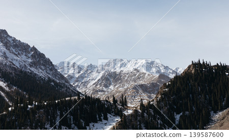 Snowy mountain landscape in Barskoon Gorge with conifer forest, Kyrgyzstan 139587600
