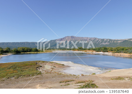 Uzon Volcano Caldera landscape with geothermal lake and mountains, Kamchatka Uzon Volcano Caldera landscape with geothermal lake and mountains, Kamchatka 139587640