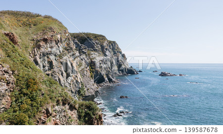 Rocky sea cliffs and blue water coastline at Velyuchinskaya Bay, Kamchatka Rocky sea cliffs and blue water coastline at Velyuchinskaya Bay, Kamchatka 139587678