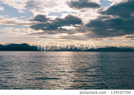 Sunset over Avacha Bay with dramatic clouds and distant mountains, Kamchatka Sunset over Avacha Bay with dramatic clouds and distant mountains, Kamchatka 139587700