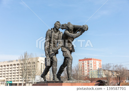 Monument to builders and workers in Bishkek city center under blue sky Monument to builders and workers in Bishkek city center under blue sky 139587701