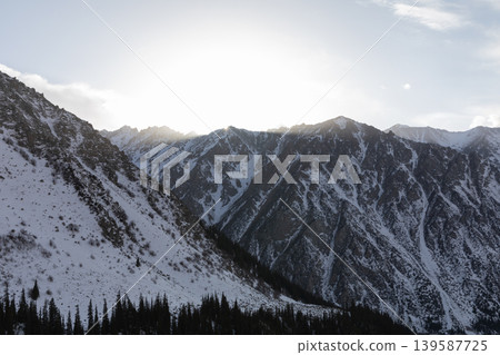 Winter mountain landscape at Ala Archa National Park with snowy ridges at sunrise Winter mountain landscape at Ala Archa National Park with snowy ridges at sunrise 139587725