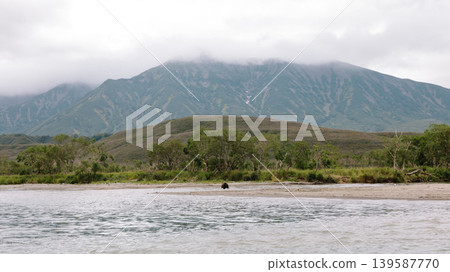 Kuril Lake landscape with volcanic mountains and wild shoreline in Kamchatka 139587770