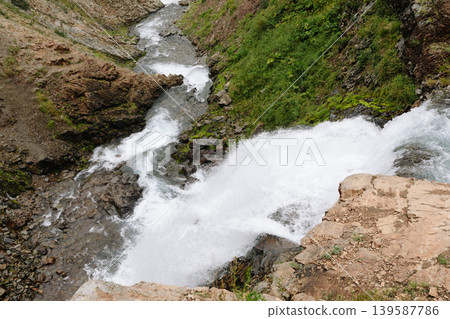 Mountain river waterfall and rocky gorge in Vachkazhets massif, Kamchatka Mountain river waterfall and rocky gorge in Vachkazhets massif, Kamchatka 139587786