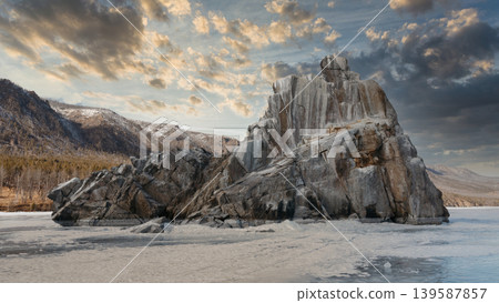 Dramatic ice-covered coastal rock formation on Lake Baikal at winter sunset Dramatic ice-covered coastal rock formation on Lake Baikal at winter sunset 139587857
