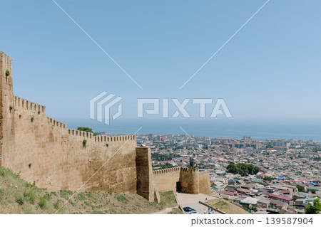 Naryn-Kala fortress walls overlooking Derbent city and Caspian Sea coastline Naryn-Kala fortress walls overlooking Derbent city and Caspian Sea coastline 139587904