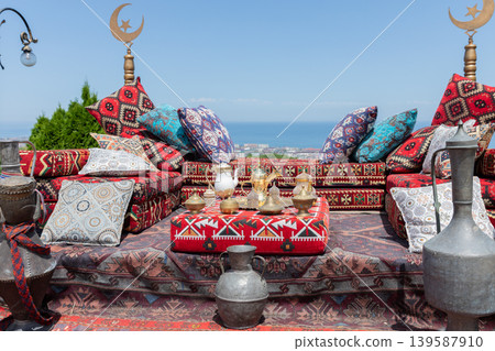 Traditional carpet seating at Naryn-Kala Fortress terrace with sea view in Derbent 139587910