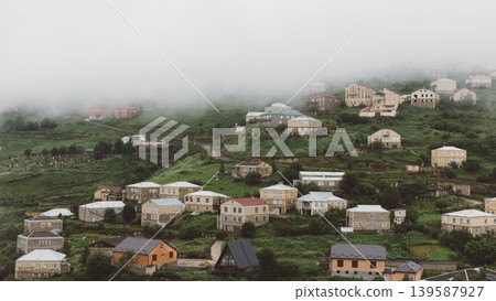 Foggy mountain village landscape with stone houses in Kubachi, Dagestan Foggy mountain village landscape with stone houses in Kubachi, Dagestan 139587927