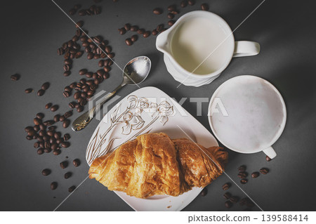 Top view of coffee and croissant with coffee bean Top view of coffee and croissant with coffee bean 139588414