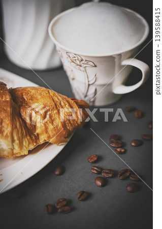 Top view of coffee and croissant with coffee bean Top view of coffee and croissant with coffee bean 139588415