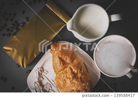 Top view of coffee and croissant with coffee bean Top view of coffee and croissant with coffee bean 139588417