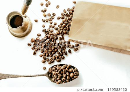 Spoon with instant coffee powder and beans on wooden background, flat lay Spoon with instant coffee powder and beans on wooden background, flat lay 139588430