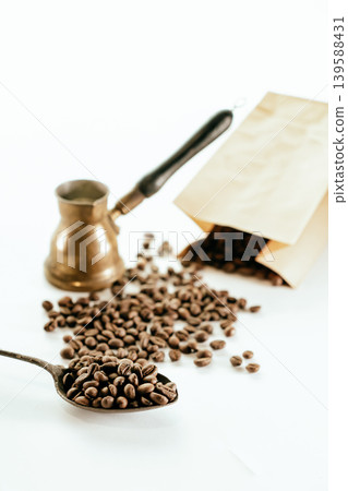 Spoon with instant coffee powder and beans on wooden background, flat lay Spoon with instant coffee powder and beans on wooden background, flat lay 139588431