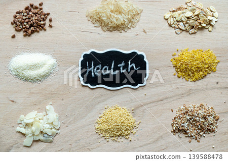 Assorted cereal grain porridge seeds set on a wooden background: buckwheat, rice, semolina, wheat, couscous, oatmeal Assorted cereal grain porridge seeds set on a wooden background: buckwheat, rice, semolina, wheat, couscous, oatmeal 139588478