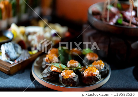 Pumpernickel bread sandwich snack with cured smoked salmon and fresh avocado served as close-up on a wooden cutting board 139588526