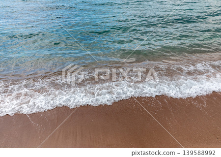 Gentle Adriatic waves on sandy beach near Sveti Stefan, Montenegro coastline 139588992