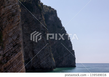 Rocky sea cliffs on Sveti Nikola Island near Budva, Montenegro coastline Rocky sea cliffs on Sveti Nikola Island near Budva, Montenegro coastline 139589016
