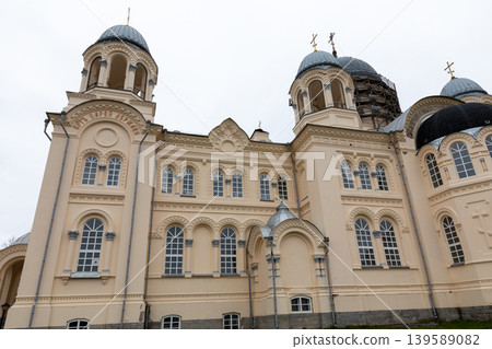 Nevyansk Orthodox cathedral facade with domes and crosses on an overcast day Nevyansk Orthodox cathedral facade with domes and crosses on an overcast day 139589082