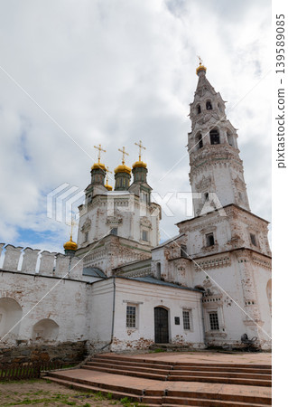 Orthodox monastery and bell tower architecture in Nevyansk, Russia under cloudy sky Orthodox monastery and bell tower architecture in Nevyansk, Russia under cloudy sky 139589085