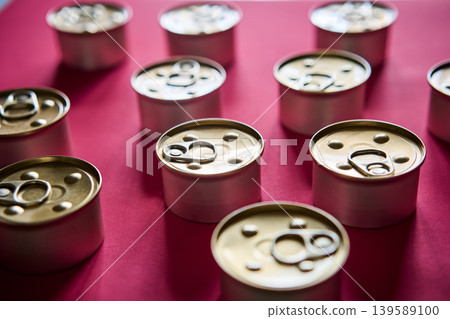 Metal tin cans on pink background Metal tin cans on pink background 139589100