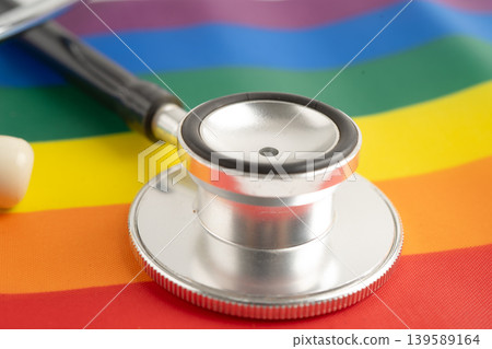Stethoscope on LGBT rainbow flag, rights and gender equality. Stethoscope on LGBT rainbow flag, rights and gender equality. 139589164