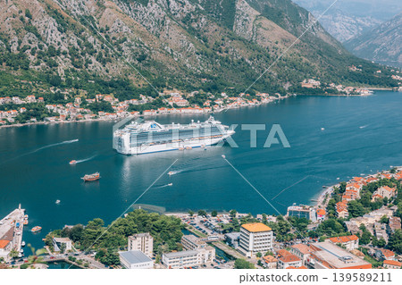Cruise ship in Kotor Bay with coastal town and mountains, Montenegro Cruise ship in Kotor Bay with coastal town and mountains, Montenegro 139589211