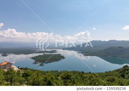 Panoramic view of Lake Skadar with islands and mountains near Virpazar 139589236