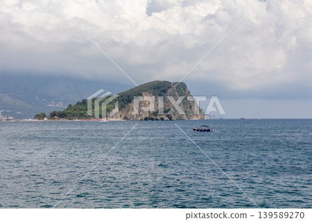 Coastal seascape with rocky peninsula and boat near Budva, Montenegro 139589270