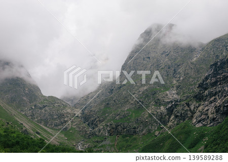Misty mountain valley landscape at Midagrabin Waterfalls in North Ossetia Misty mountain valley landscape at Midagrabin Waterfalls in North Ossetia 139589288