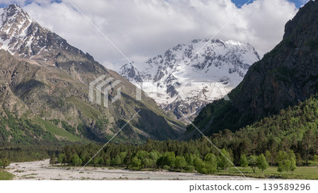 Mount Ullutau sacred peak and glacier valley landscape in the Caucasus mountains Mount Ullutau sacred peak and glacier valley landscape in the Caucasus mountains 139589296