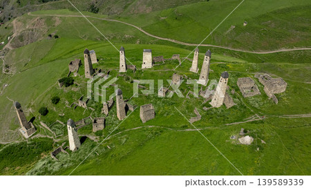 Aerial view of Erzi tower complex ruins in Olgeti mountain valley, Ingushetia Aerial view of Erzi tower complex ruins in Olgeti mountain valley, Ingushetia 139589339