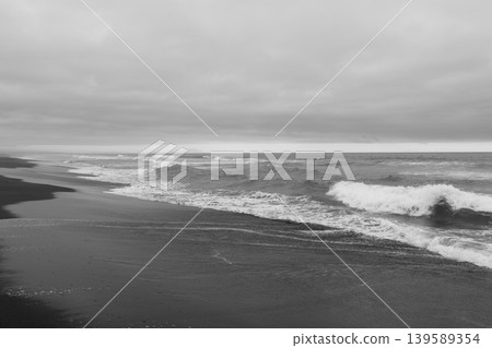 Dramatic waves on black volcanic sand at Khalaktyrsky Beach, Kamchatka Dramatic waves on black volcanic sand at Khalaktyrsky Beach, Kamchatka 139589354