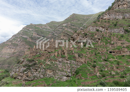 Ancient stone ruins and mountain landscape near Kahib village, Dagestan region 139589405