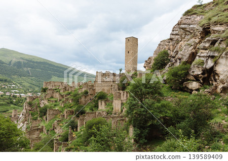 Ancient stone tower and abandoned mountain village ruins in Kahib, Dagestan Ancient stone tower and abandoned mountain village ruins in Kahib, Dagestan 139589409