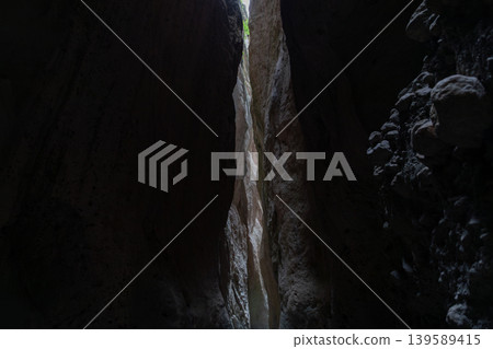 Dramatic narrow rock canyon passage in Karadakh Gorge, Dagestan, Russia Dramatic narrow rock canyon passage in Karadakh Gorge, Dagestan, Russia 139589415