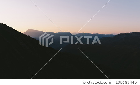 Sunset panorama of mountain valley landscape in Dagestan, Caucasus region Sunset panorama of mountain valley landscape in Dagestan, Caucasus region 139589449