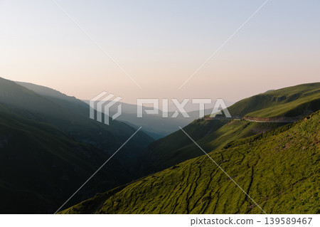 Mountain valley landscape with winding road at sunset in Dagestan, Caucasus region 139589467