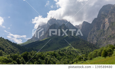Dramatic mountain landscape in Galgai Gorge with clouds and green forest slopes Dramatic mountain landscape in Galgai Gorge with clouds and green forest slopes 139589480
