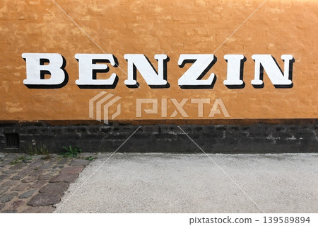 Gasoline sign on a wall in Denmark called benzin in Danish language 139589894