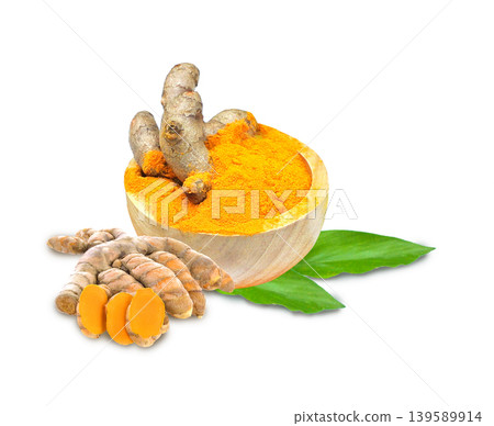 Turmeric powder in a wooden bowl with fresh turmeric roots, featuring a vibrant golden-yellow color  on  white background. 139589914