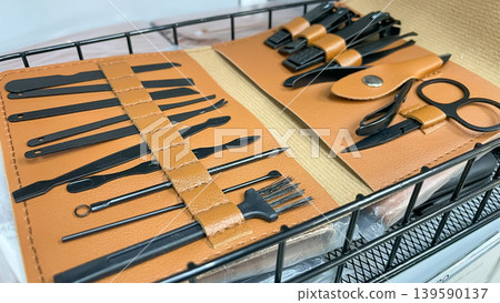 Professional manicure and grooming set with matte black tools in a stylish tan leather organizer case Professional manicure and grooming set with matte black tools in a stylish tan leather organizer case 139590137