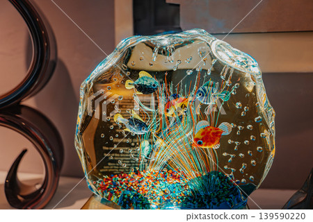 Murano glass aquarium sculpture with colorful fish and bubbles. Venetian art Murano glass aquarium sculpture with colorful fish and bubbles. Venetian art 139590220