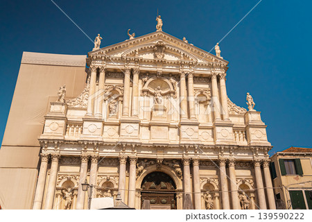 Historic Baroque Church Facade in Venice with Sculptures and Columns 139590222