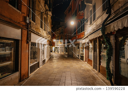 Empty Venice street at night with soft lights and historic architecture Empty Venice street at night with soft lights and historic architecture 139590228